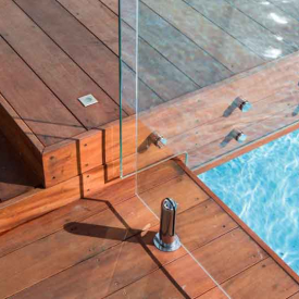 Mahogany-decking-glass-railing-pool-green-world-lumber